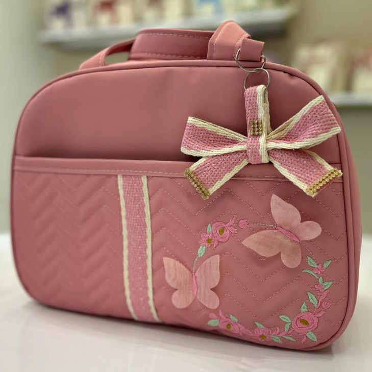 Bolsa Maternidade Borboleta com laço rosa de lado