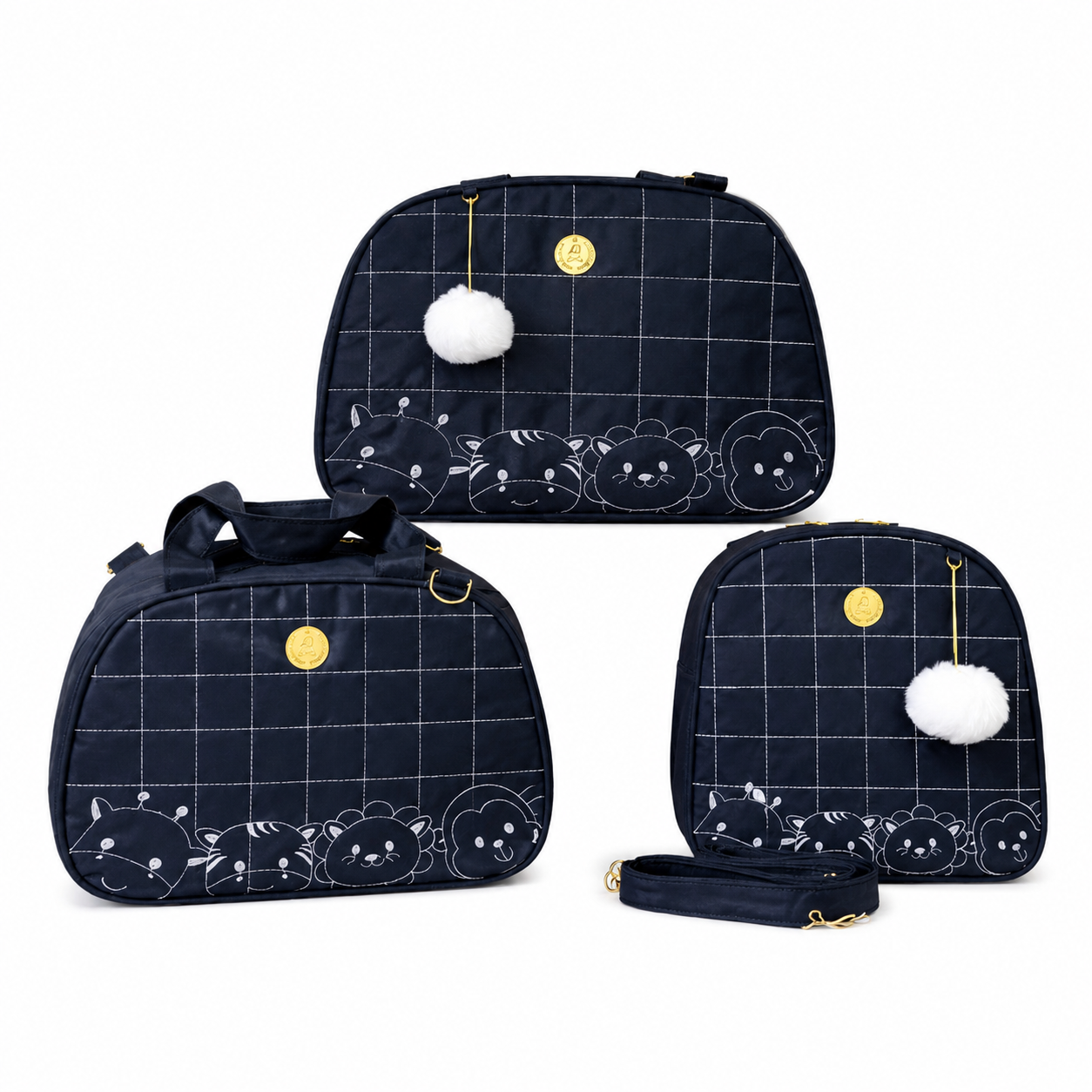 Kit de três bolsas maternidade azul-escuro com estampa quadriculada e de animais, vista frontal.