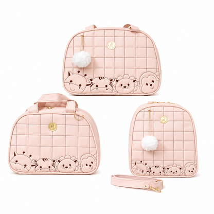 Três bolsas de maternidade rosa com rostos de animais fofos em fundo branco.