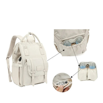 Mochila de maternidade bege com ilustrações detalhadas de seus compartimentos térmicos para mamadeiras.
