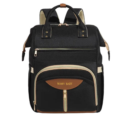 Mochila de maternidade preta estruturada vista de frente com detalhes dourados e beges.