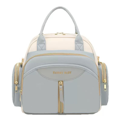 Bolsa de maternidade estruturada azul-claro e creme, vista de frente com detalhes dourados.