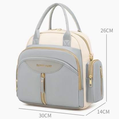 Bolsa maternidade cinza e creme vista em perspectiva com suas dimensões marcadas.