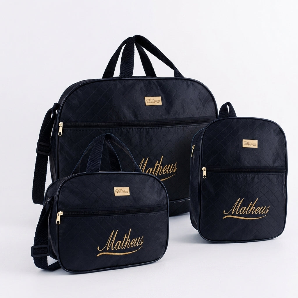 Três bolsas de maternidade pretas personalizadas com nome Matheus em dourado.