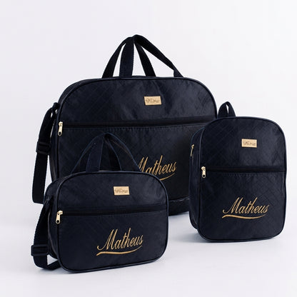 Três bolsas de maternidade pretas personalizadas com nome Matheus em dourado.