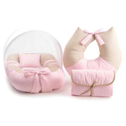 Kit enxoval de bebê rosa e bege com ninho, almofada de amamentação e trocador.