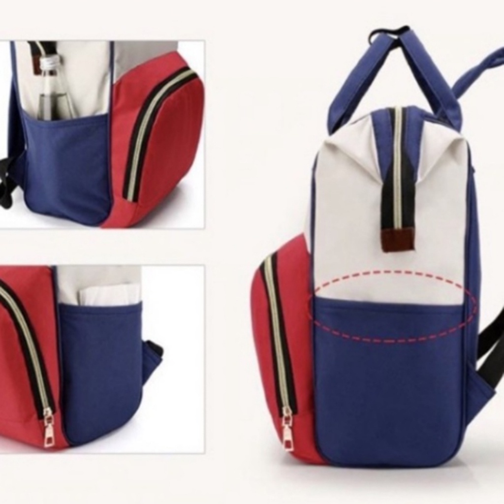 Mochila de maternidade tricolor azul, vermelha e bege com destaque para os bolsos laterais.