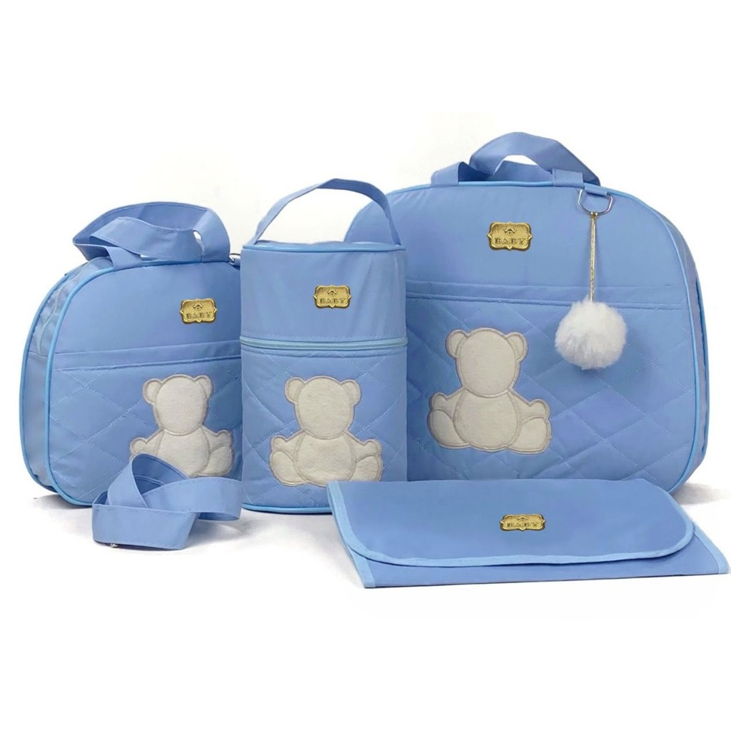 Conjunto de bolsas de maternidade azul-claro com apliques de ursinho em ângulo frontal.